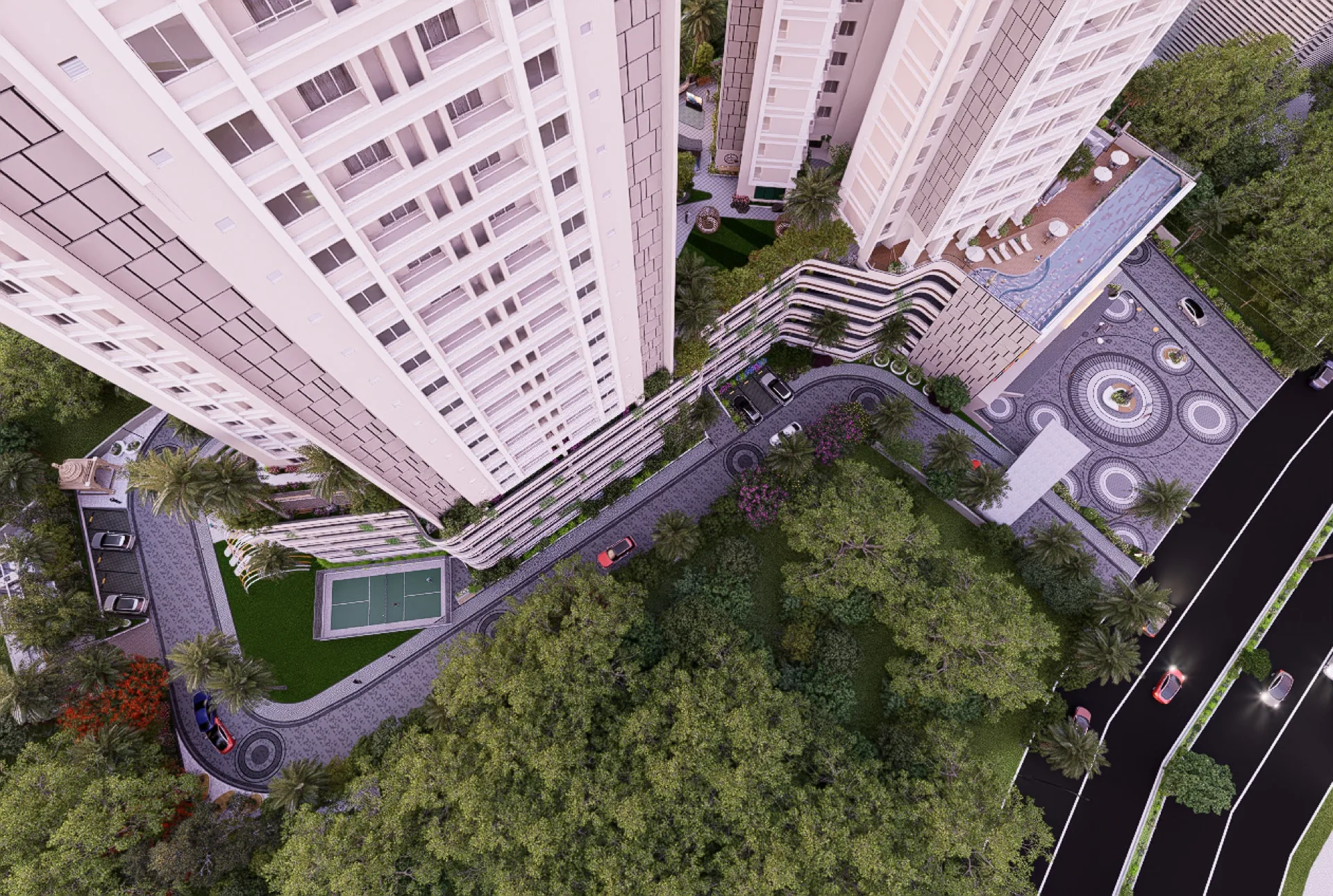 Aerial view between the Vumee Amrapalli towers looking down at the pool and landscaped podium